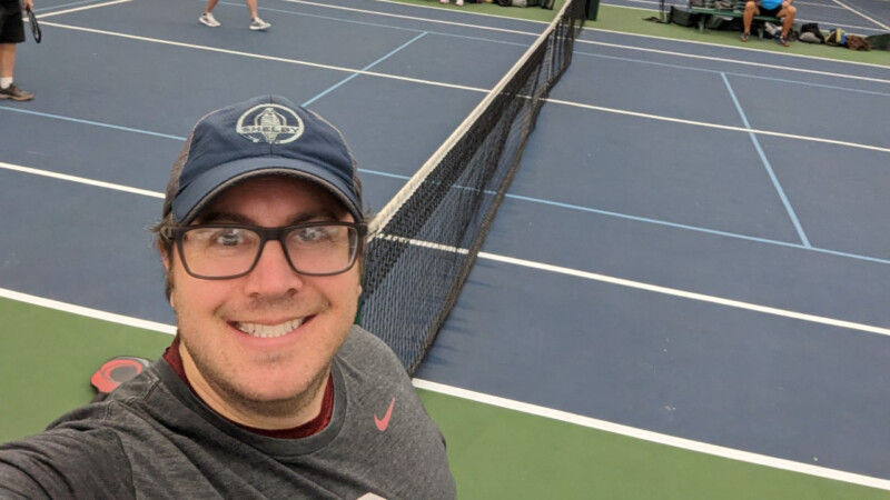 Bradley Reed taking a selfie on a pickleball court